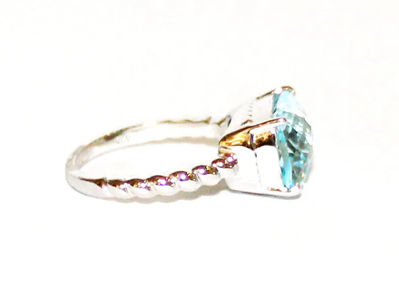 East And West Blue Topaz Ring