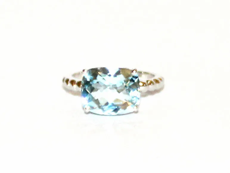 East And West Blue Topaz Ring